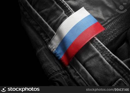 Tag on dark clothing in the form of the flag of the Russia.. Tag on dark clothing in the form of the flag of the Russia