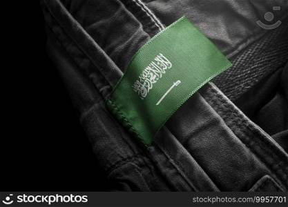 Tag on dark clothing in the form of the flag of the Saudi Arabia.. Tag on dark clothing in the form of the flag of the Saudi Arabia