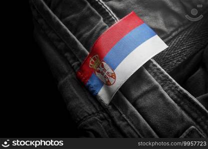 Tag on dark clothing in the form of the flag of the Serbia.. Tag on dark clothing in the form of the flag of the Serbia