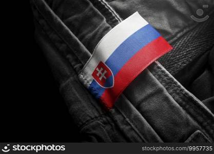 Tag on dark clothing in the form of the flag of the Slovakia.. Tag on dark clothing in the form of the flag of the Slovakia