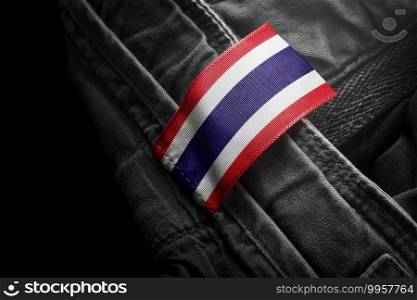 Tag on dark clothing in the form of the flag of the Thailand.. Tag on dark clothing in the form of the flag of the Thailand