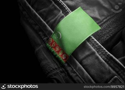 Tag on dark clothing in the form of the flag of the Turkmenistan.. Tag on dark clothing in the form of the flag of the Turkmenistan