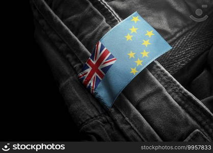 Tag on dark clothing in the form of the flag of the Tuvalu.. Tag on dark clothing in the form of the flag of the Tuvalu