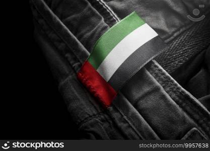 Tag on dark clothing in the form of the flag of the United Arab Emirates.. Tag on dark clothing in the form of the flag of the United Arab Emirates
