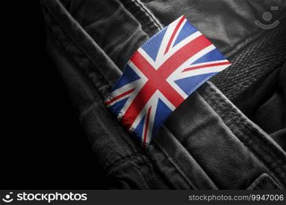 Tag on dark clothing in the form of the flag of the United Kingdom.. Tag on dark clothing in the form of the flag of the United Kingdom