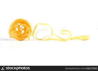 Tagliatelle pasta on white background