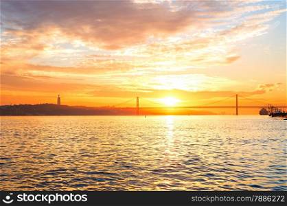 Tagus river and 25 April bridge at sunset. Lisbon, Portugal