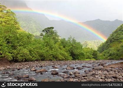 Tahiti. Mountain river and rainbow