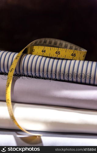 Tailor's Tape Measure and Fabric Swatches. Folded Mens Shirt Cloth