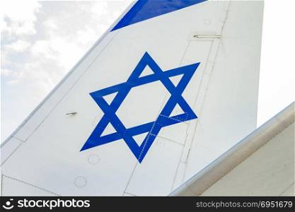 Tailplane of an airplane with a drawing of the Israeli flag.