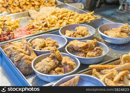 Taiwanese fried chicken and squid at traditional market in Taipei
