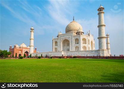 Taj Mahal on a sunny day. An ivory-white marble mausoleum on the south bank of the Yamuna river in Agra, Uttar Pradesh, India. One of the seven wonders of the world.. Taj Mahal on a sunny day.