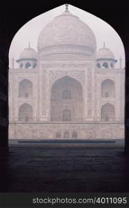 Taj Mahal seen through arch