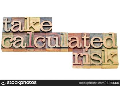 take calculated risk - isolated word abstract in letterpress wood type