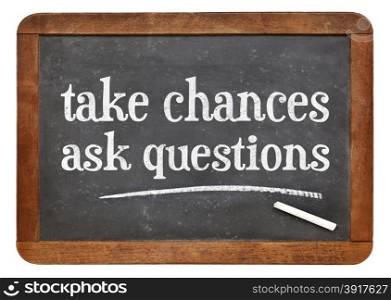 Take chances, ask questions - motivational advice on a vintage slate blackboard