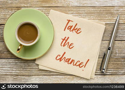 take the chance reminder note - motivational handwriting on a napkin with a cup of coffee, business or personal development concept