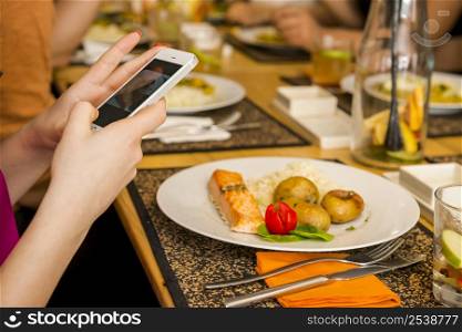 Taking a picture of the food at the restaurant