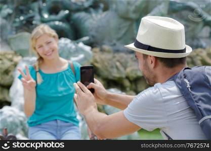 taking pictures and posing for each other