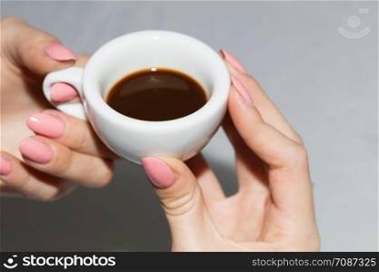 Taking the neapolitan coffee in ceramic cup