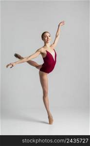 talented ballerina performing full shot