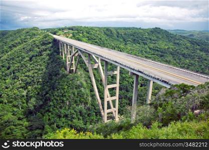 Tall bridge over a green valley in Cuba