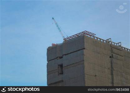 Tall buildings under construction in the blue sky background and have copy space.