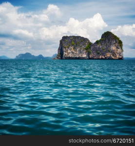 tall cliff with trees at Andaman Sea, Thailand