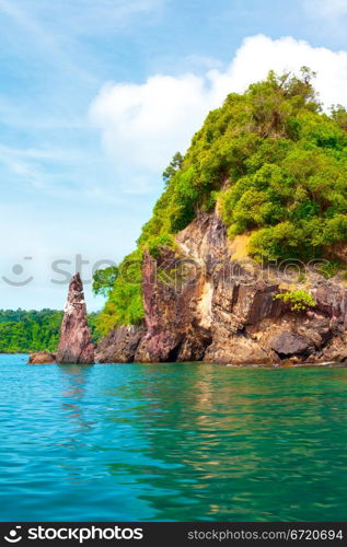 tall cliff with trees at Andaman Sea, Thailand