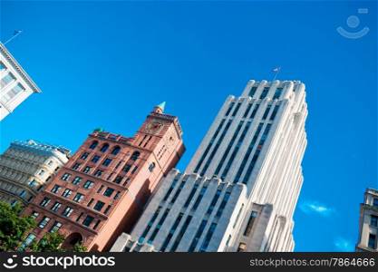 Tall downtown business buildings on a clear summer day