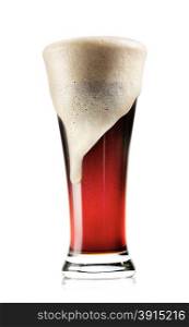 Tall glass of dark beer with foam isolated on white background. Tall glass of dark beer with foam