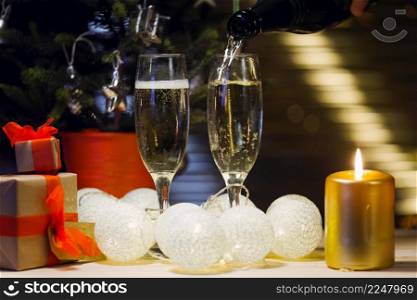tall glasses with glowing golden candle