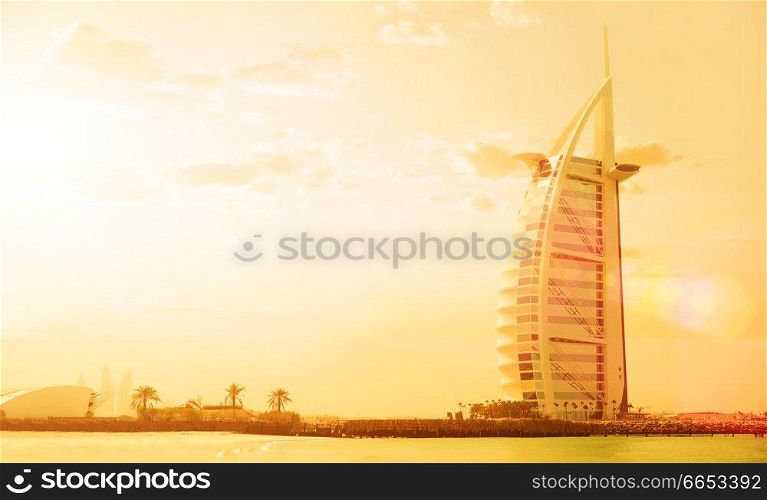 Tall house on sea coast at sunset