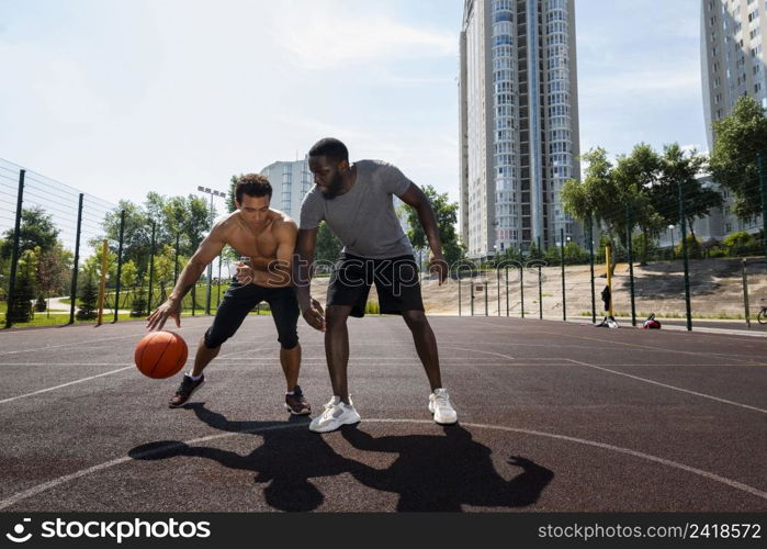 tall men playing urban basketball