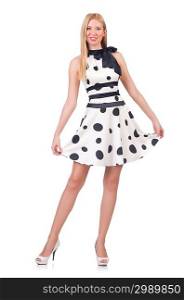 Tall model dressed in dress with polka dosts on white