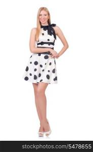Tall model dressed in dress with polka dosts on white