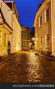 Tallinn Old Town street with cobblestones in night, Estonia. Tallinn street in night, Estonia