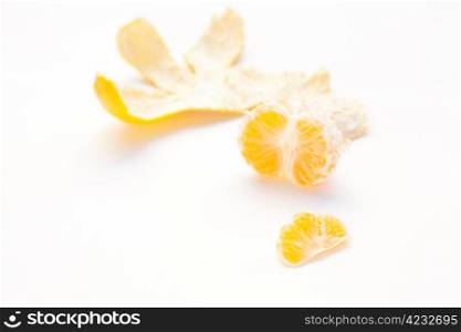 tangerine and his skin on a white background