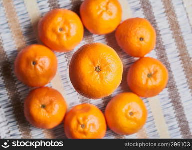 tangerine basket with artisan tablecloth background