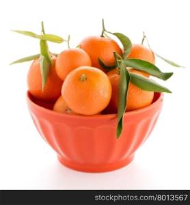 Tangerines on ceramic orange bowl isolated on white background