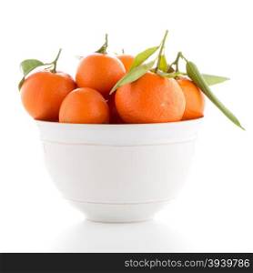 Tangerines on ceramic white bowl isolated on white background