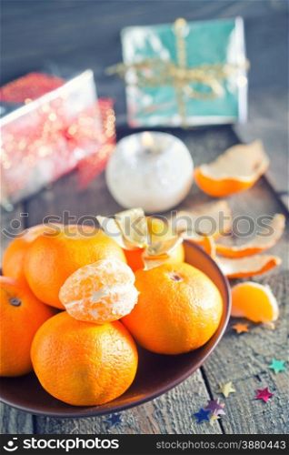 tangerines on plate and on a table