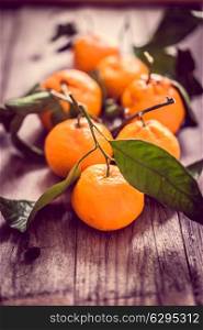 Tangerines on rustic background
