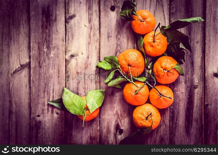 Tangerines on rustic background