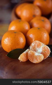 tangerines. Ripe tangerines on wooden background