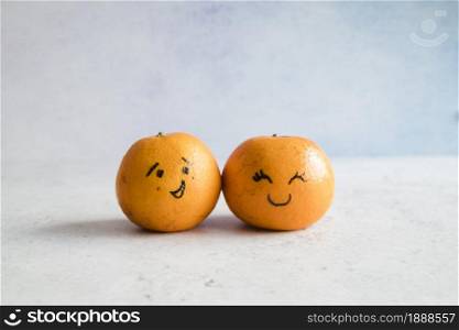 tangerines with funny faces. Resolution and high quality beautiful photo. tangerines with funny faces. High quality and resolution beautiful photo concept
