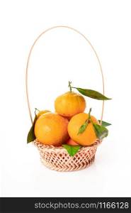 tangerines with leaves in a beautiful basket. organic ripe mandarins