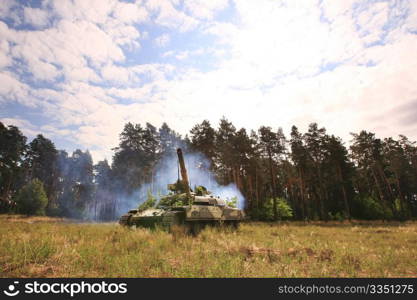 tank rides on the field