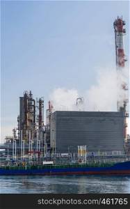 Tanker boat loading fuel from oil Chemical Factory in Kawasaki Japan