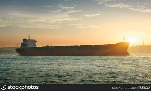 Tanker in the waters of Bosphorus in Istanbul at sunset, Turkey