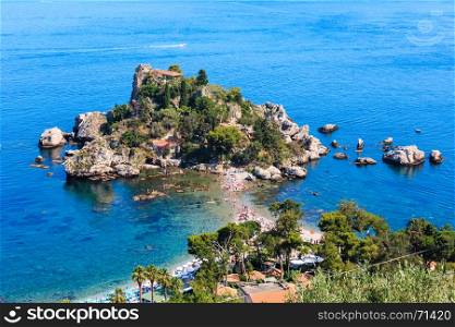 Taormina Isola Bella beach and Isola Bella islet view from up, Sicily, Italy. Summer Sicilian seascape with sea coast, beaches and island. People unrecognizable (people specially some blurred).